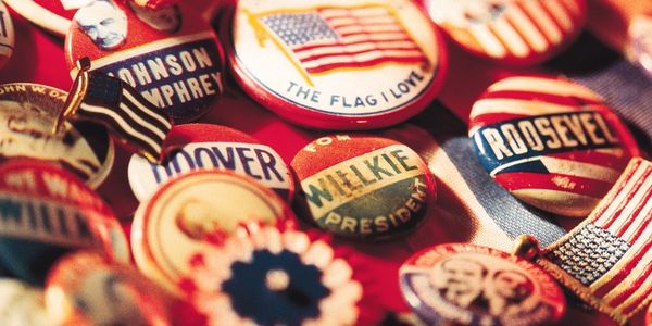 political campaign buttons with slogans